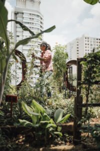 Lady tending to her balcony garden
